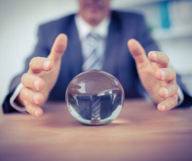 Businessman forecasting a crystal ball in the office